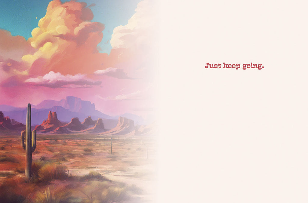 Open inspiring greeting card for a friend, showing a faint desert landscape illustration on the left and a blank space on the right, with simple red text 'Just keep going.' A subtle, hopeful interior design for an encouraging message.