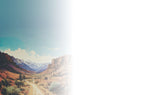 Scenic background image for a 'Happy Trails' farewell card, depicting a desert valley and distant mountains with a clear sky, fading gently to white on the right side for customizable text.