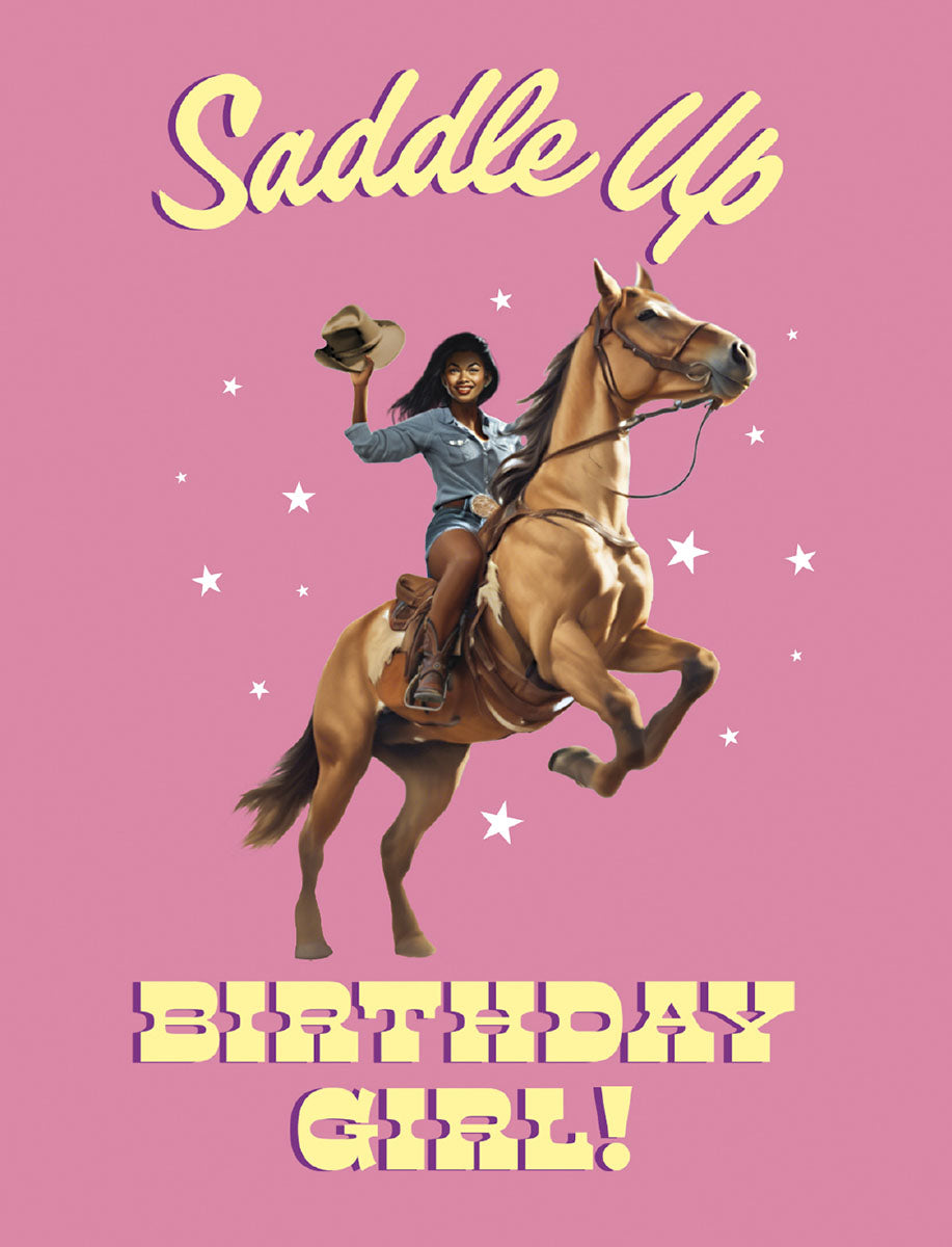 Vibrant pink greeting card featuring a joyful African American woman in a denim shirt and cowboy hat, riding a rearing brown horse with 'Saddle Up' and 'Birthday Girl!' text and white stars. Perfect for a fun celebration.