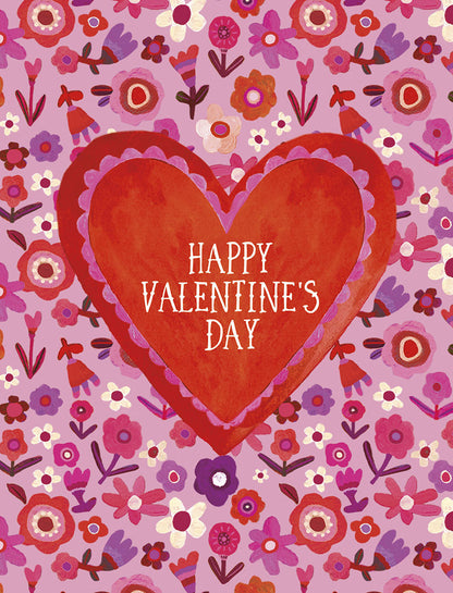 Front of a Valentine's Day greeting card with a large red heart over a background of small red, pink, and purple flowers.