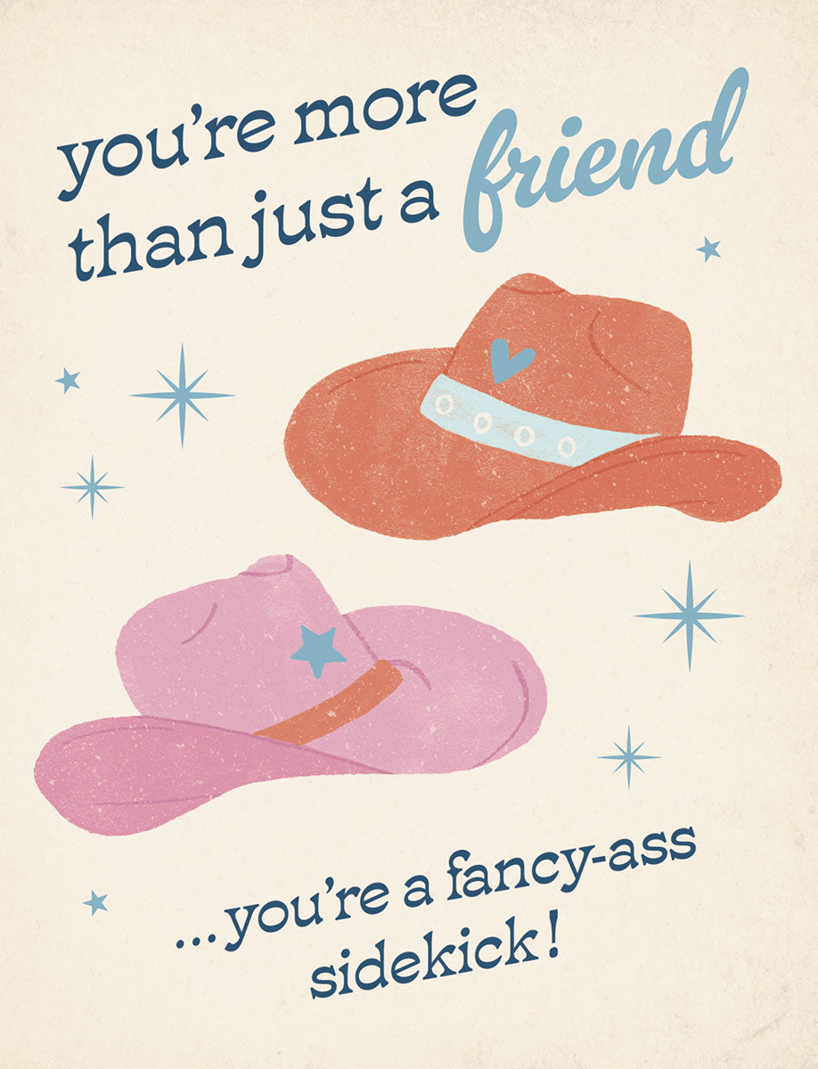 Front of a fun greeting card featuring two stylized cowboy hats, one pink and one orange, with the playful text 'you're more than just a friend... you're a fancy-ass sidekick!' Perfect for best pals.