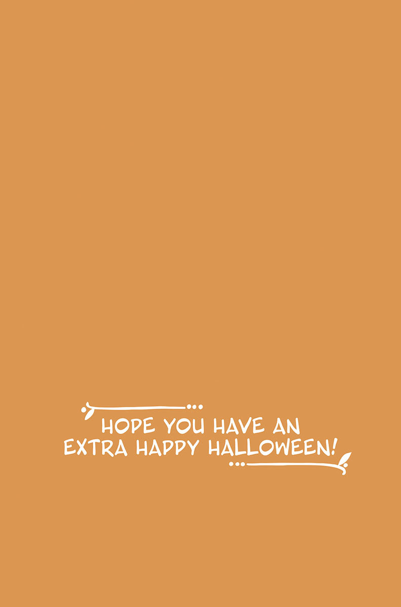 Inside of a cheerful fall greeting card with a warm orange background, featuring the white script message 'Hope you have an extra happy Halloween!' and decorative flourishes.