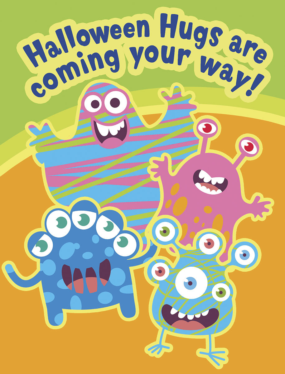 Front of a playful Halloween greeting card featuring four colorful, smiling cartoon monsters in blue, pink, and striped patterns, with text 'Halloween Hugs are coming your way!' against a vibrant green and orange background.