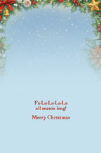 Inside view of a festive greeting card featuring a light blue background with snowflakes and the joyful holiday message 'Fa-La-La-La-La all season long! Merry Christmas' in elegant red font.
