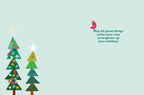 Inside of a holiday greeting card with decorative trees, a small red bird, and the cheerful message: 'May all good things come your way to brighten up your holiday!'.