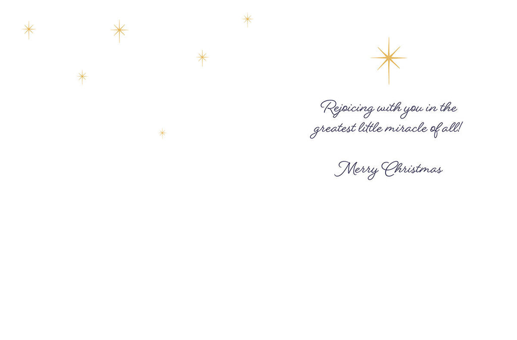 Inside view of a religious holiday greeting card featuring the message 'Rejoicing with you in the greatest little miracle of all! Merry Christmas' surrounded by golden stars.
