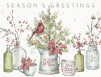 Watercolor greeting card set featuring a cardinal on an evergreen, winter berries, cotton branches, and rustic holiday decor, with 'Season's Greetings' text.