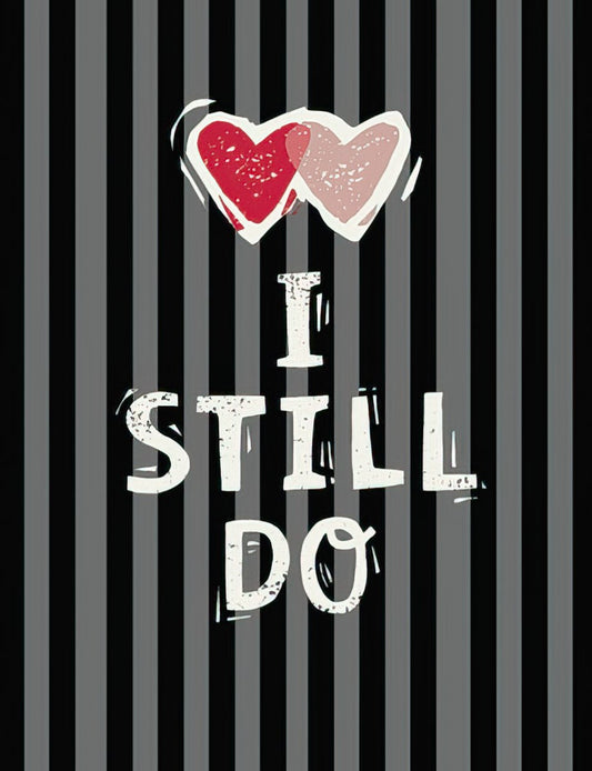 Anniversary card front: 'I Still Do' on black/grey stripes with two red hearts. Expresses enduring love and commitment.