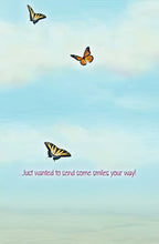 Inside of a cute friendship card featuring a serene blue sky, three vibrant butterflies, and the warm message 'Just wanted to send some smiles your way!'.