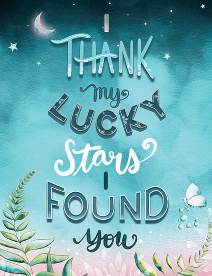 Teal greeting card front: 'I Thank My Lucky Stars I Found You' in decorative script with stars, moon, and foliage.