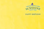 Bright yellow interior of a greeting card with text 'YOU'RE KINDA LIKE SUNSHINE THAT WAY HAPPY BIRTHDAY'. Perfect for an uplifting message.