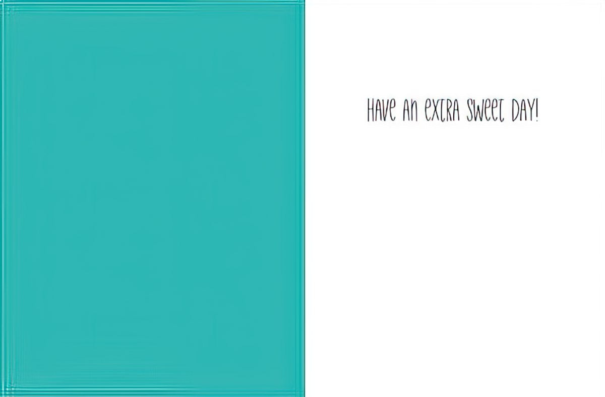 Inside of a greeting card with a solid teal panel on the left and a white panel on the right, featuring the handwritten-style text 'HAVE AN EXTRA SWEET DAY!' on the right. Blank space for personal messages.