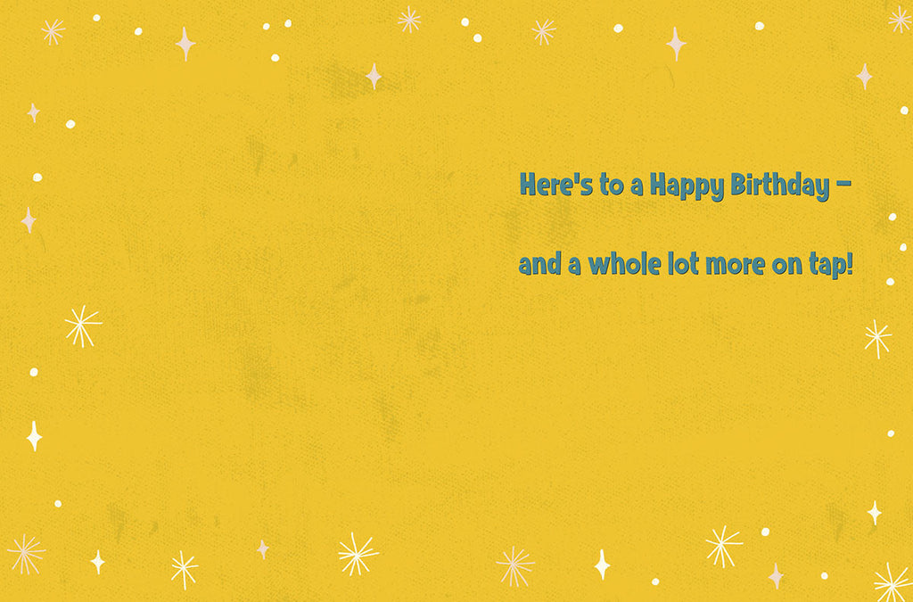 Inside of a cheerful yellow greeting card with white starbursts and dots, featuring the message 'Here's to a Happy Birthday – and a whole lot more on tap!' in blue text.