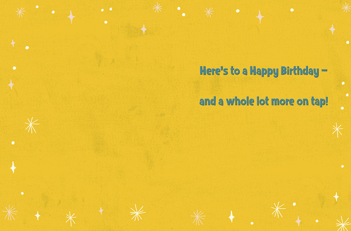 Inside of a cheerful yellow greeting card with white starbursts and dots, featuring the message 'Here's to a Happy Birthday – and a whole lot more on tap!' in blue text.
