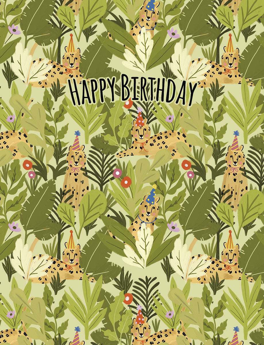 Whimsical greeting card front with cheetahs in party hats amidst lush green jungle leaves, text 'Happy Birthday'.