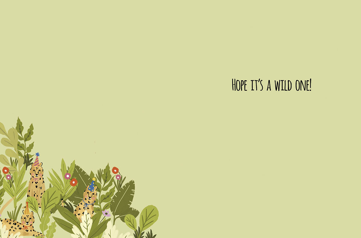 Inside of a jungle-themed greeting card, featuring cheetahs and tropical foliage, with the playful message 'Hope it's a wild one!'