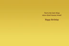 Inside of a funny banana-themed greeting card, displaying the heartfelt and humorous message 'You're the best thing since sliced banana bread! Happy Birthday' on a warm yellow background.