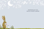 Inside of a cute friendship card featuring a rabbit and mouse illustration with the text 'Thinking of you with a happy heart', with ample blank space for a custom message.