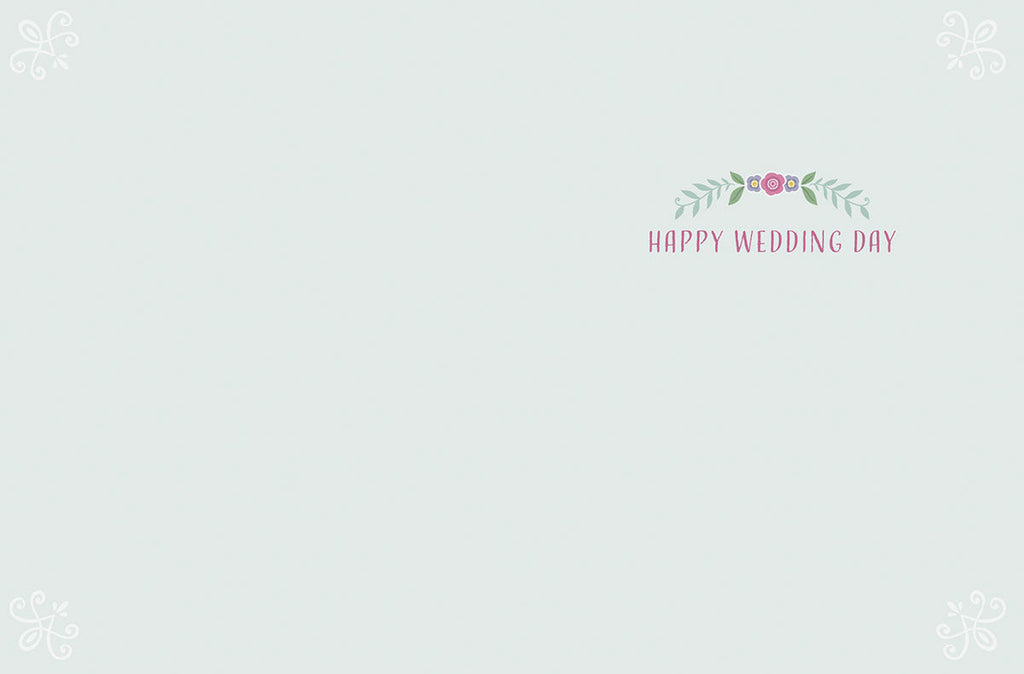 Inside of a romantic wedding card displaying 'Happy Wedding Day' in delicate pink lettering with a small floral cluster, against a light blue-grey background, offering ample space for a personalized message.