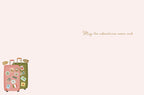 Inside view of a romantic anniversary card featuring the elegant message 'May the adventures never end.' accompanied by a small illustration of matching travel suitcases in the bottom corner.