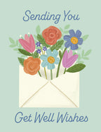 Illustrated get well card front featuring a colorful bouquet of flowers bursting from an envelope with the message 'Sending You Get Well Wishes' on a light blue background.