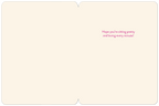Inside view of a lighthearted birthday card for a friend, showing a blank cream interior with the thoughtful pink message 'Hope you're sitting pretty and loving every minute!'