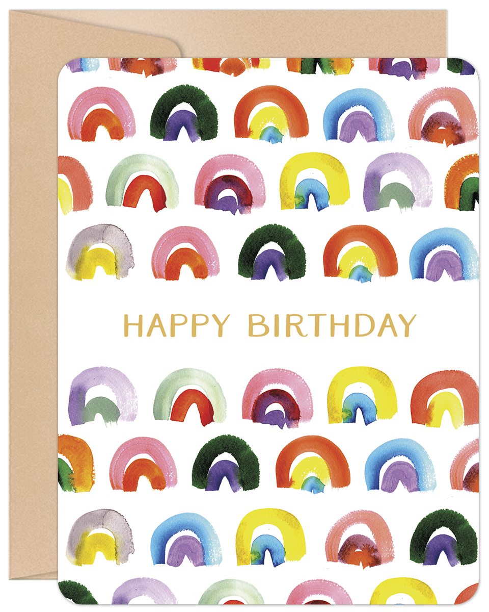 Vibrant watercolor rainbow patterned greeting card with 'HAPPY BIRTHDAY' in gold text on the front, next to a kraft envelope.