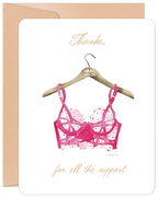 Funny greeting card for her, featuring a watercolor illustration of a pink bra on a wooden hanger with 'Thanks... for all the support' text in gold script, perfect for a supportive woman or bestie.