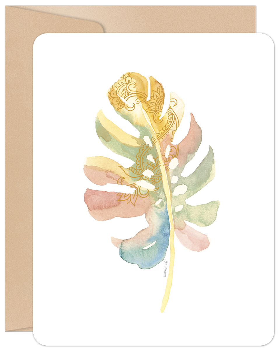 Pastel watercolor palm leaf blank note card with intricate gold mandala patterns and a kraft envelope.