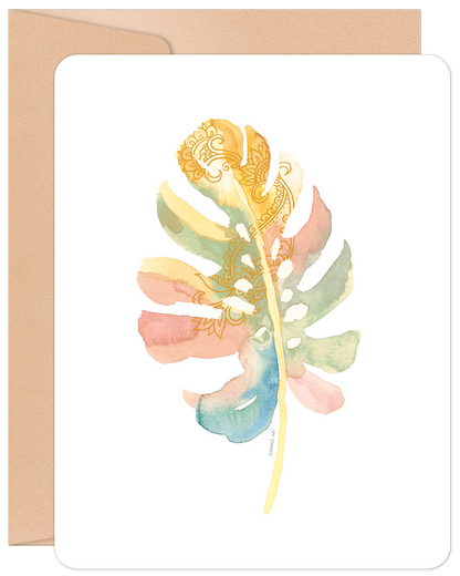 Pastel watercolor palm leaf blank note card with intricate gold mandala patterns and a kraft envelope.