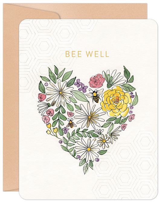 Front of a 'Bee Well' get well card featuring a heart made of colorful flowers and two small bees, with a subtle honeycomb pattern.