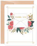 Front of a heartfelt gratitude greeting card featuring a watercolor illustration of an open white envelope with 'THANK YOU' text, surrounded by vibrant pink and red flowers, green leaves, and small golden hearts, all framed by an elegant gold border on a white background.