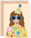 Vibrant groovy celebration card featuring a cartoon person with brown hair, blue floral sunglasses, and a striped party hat, wearing a yellow top adorned with colorful flowers, rainbows, strawberries, and cherries. Perfect for a friend's special day.