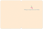 Inside of a cute, lighthearted celebration card displaying the message 'Wishing you only good vibes on your birthday.' with two pink cherries, providing ample space for a personalized note to a friend.
