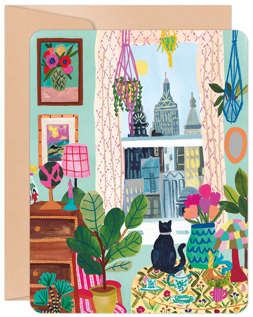 SEO-optimized alt description for a greeting card featuring a vibrant illustration of a cozy indoor scene. A black cat sits on a patterned sofa, looking out a window at a city skyline. The room is decorated with numerous potted plants, macrame hangers, colorful lamps, and framed artwork, creating a cheerful, artistic, and inviting atmosphere. The card has rounded corners and a brown envelope visible behind it.