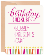 Front view of a lighthearted celebration card with 'Birthday Checklist' text, featuring checkboxes for 'Bubbly', 'Presents', and 'Cake' in pink script, accented with colorful candles and presented with a kraft envelope.