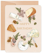 Elegant birthday greeting card featuring a detailed watercolor illustration of a charcuterie board with various gourmet cheeses like brie, blue cheese, and cheddar, alongside green grapes, dark figs, green olives, walnuts, and a cheese knife, all on a light peach background with 'HAPPY BIRTHDAY' text. Perfect for food lovers.