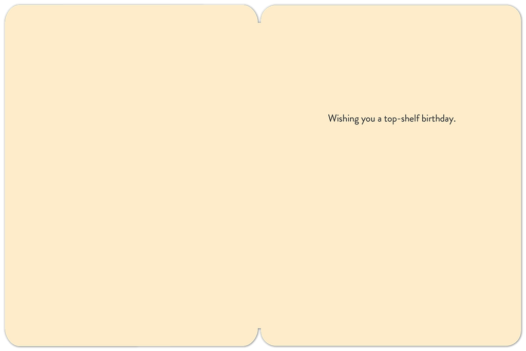 Interior view of an open cream-colored greeting card with the message 'Wishing you a top-shelf birthday.' printed in black script on the right side, conveying a witty and celebratory sentiment.