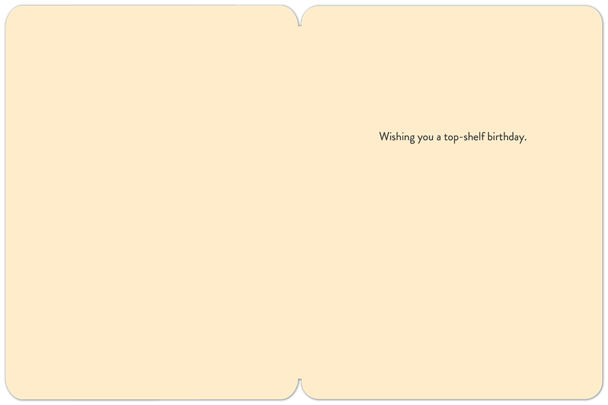 Interior view of an open cream-colored greeting card with the message 'Wishing you a top-shelf birthday.' printed in black script on the right side, conveying a witty and celebratory sentiment.