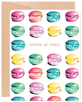 Front view of a cheerful birthday greeting card featuring an array of watercolor macarons in pink, green, yellow, and blue. The text 'YOU'RE SO FANCY' is centered among the sweet treats, perfect for a special celebration.