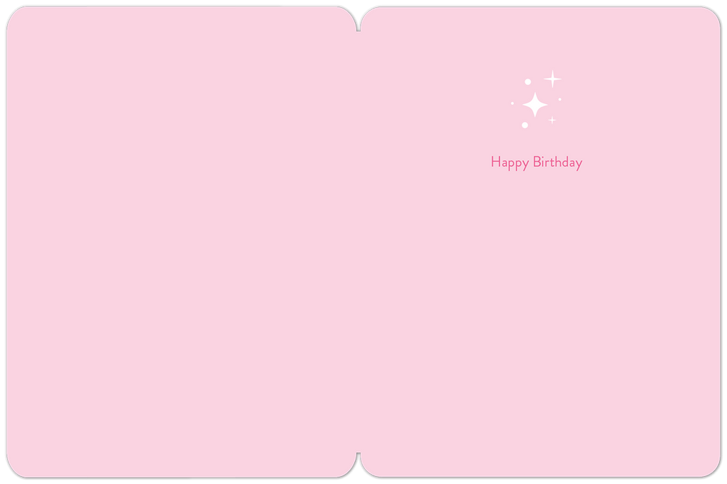 Inside of a light pink celebratory card with small sparkling accents and 'Happy Birthday' printed in a subtle script, ready for a personal message.