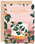 Elegant botanical birthday greeting card featuring a white cake with green leaves and orange berries, three candles, on a soft pink background with a kraft envelope. Perfect for a parent.