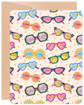 Front view of a cute birthday greeting card featuring a vibrant, repeating pattern of various colorful sunglasses on a light pink background with gold polka dots, perfect for Her.
