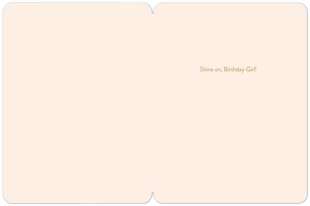 Inside view of a playful greeting card with a simple border, displaying the encouraging message 'Shine on, Birthday Girl!' in elegant gold text on a cream background.