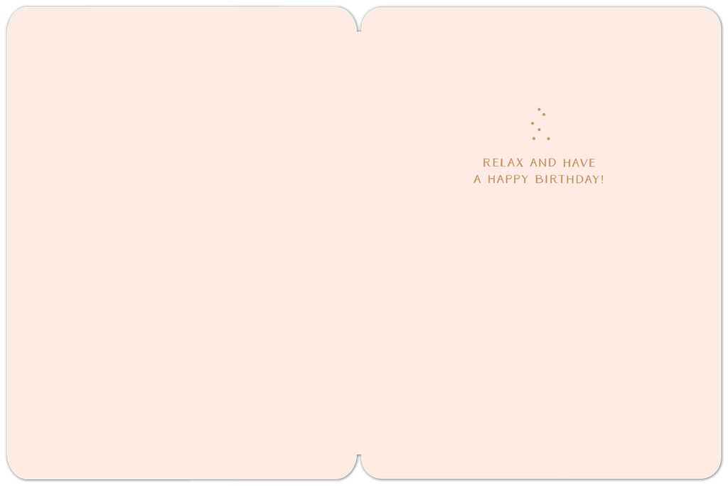 Inside view of a light pink greeting card with minimal design. Gold text on the right side reads 'RELAX AND HAVE A HAPPY BIRTHDAY!'