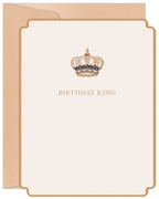 Elegant cream greeting card with ornate gold and blue royal crown illustration. The card features the text 'BIRTHDAY KING' centered below the crown. A beige envelope is visible behind the card.