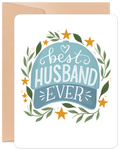 Heartfelt greeting card featuring a light blue baseball cap illustration with 'Best HUSBAND EVER' text, surrounded by green olive branches and golden stars, presented with a kraft paper envelope. Ideal for a husband's birthday or anniversary.
