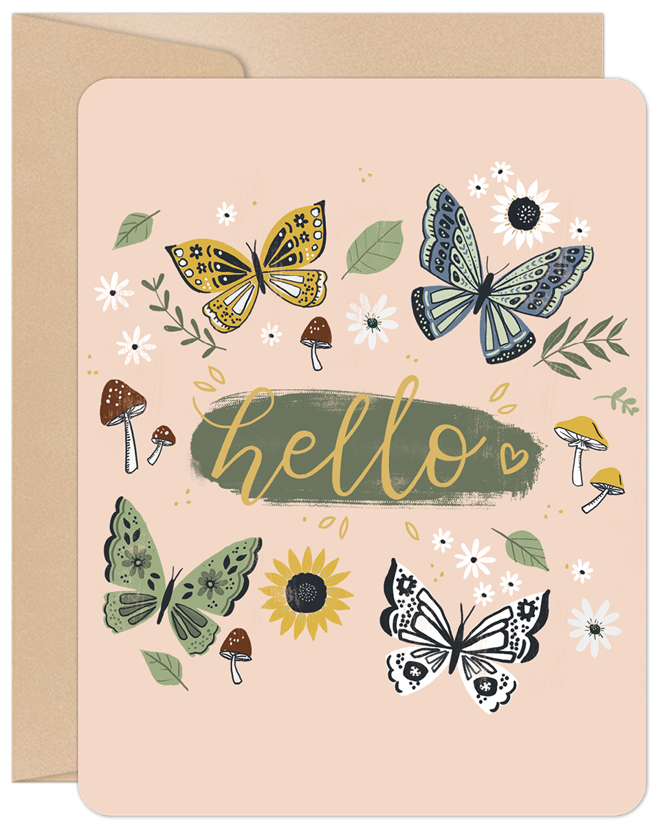 Front of a charming greeting card featuring colorful butterflies, whimsical mushrooms, and scattered flowers with 'hello' in cursive on a light pink background.