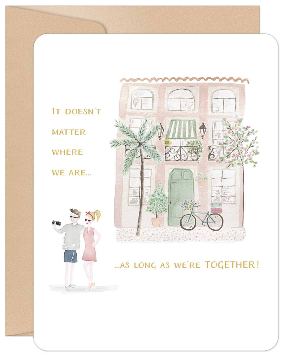 Front of 'Home Is Wherever' anniversary card, featuring a charming pink house watercolor and a couple taking a selfie, with heartfelt text.