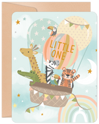 Cute hot air balloon greeting card featuring a giraffe, alligator, zebra, toucan, and tiger celebrating a tiny traveler's arrival, set against a starlit sky with a rainbow.